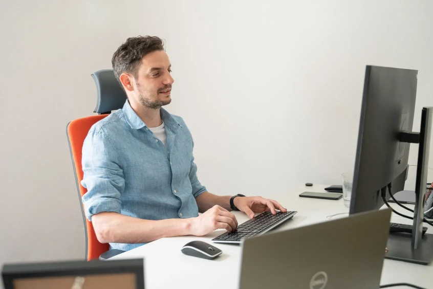 NITTIN CEO Pavel Hess working on a computer